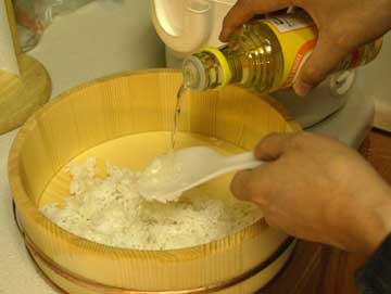 Pour vinegar over rice