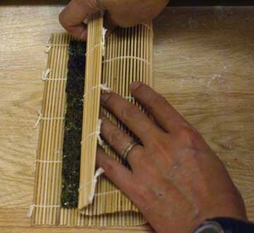 Fold the sushi mat for sushi rolls