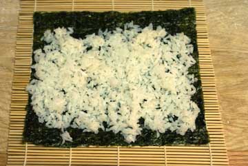 Rice on to make sushi rolls